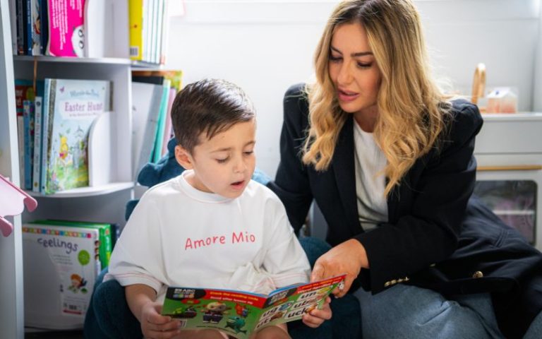 Mother and child using Reading Eggs Book 1